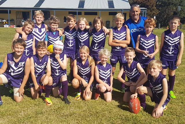 Future star: Melanie Staunton (front row, fourth from left) and her Ulladulla Dockers team. Mel is already playing rep football and has a bright future ahead.
