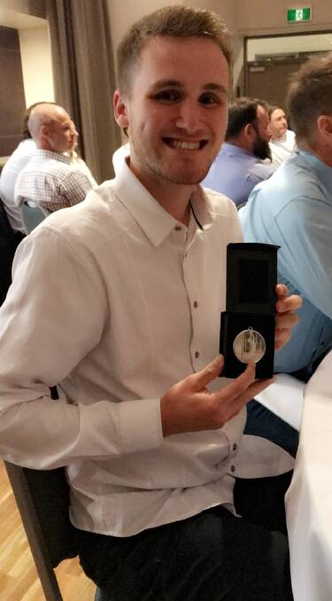 STOKED: Ulladulla Dockers' Tyler McCabe with his AFLSC award.
