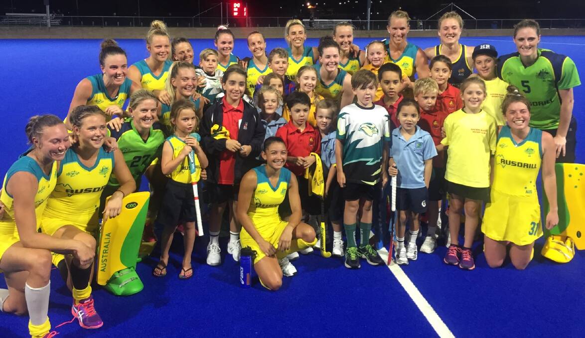 Kalindi Commerford (back row, fourth from left) and her Hockeyroos team mates after the match. Photo: HOCKEYROOS