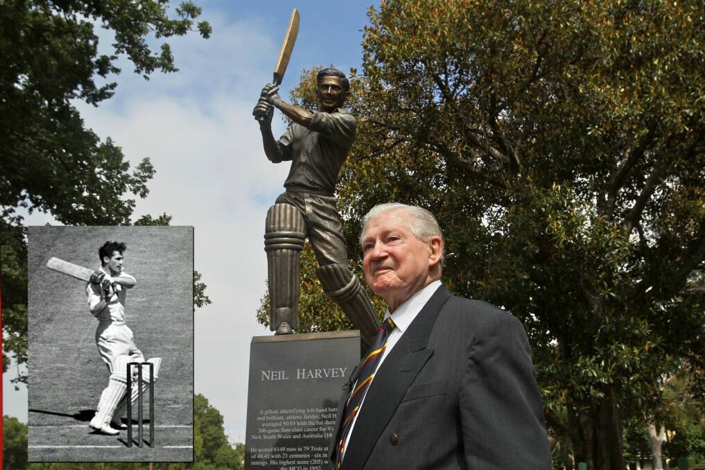 LEGEND: Neil Harvey with his statue at the Melbourne Cricket Ground Photo: Ken Irwin. Inset: Harvey in action during his playing days. 