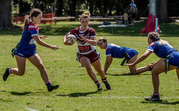 Eagles' Tori Barham makes a break against the Lions at Kevin Walsh Oval. Photo: Jeff Shep