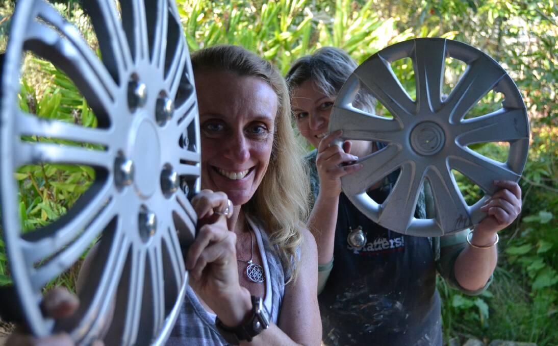 COLOUR WHEEL: Lisa Leyson and Julie Sydenham are on the hunt for old hubcaps to be used as part of a community art project during this year's Escape ArtFest.