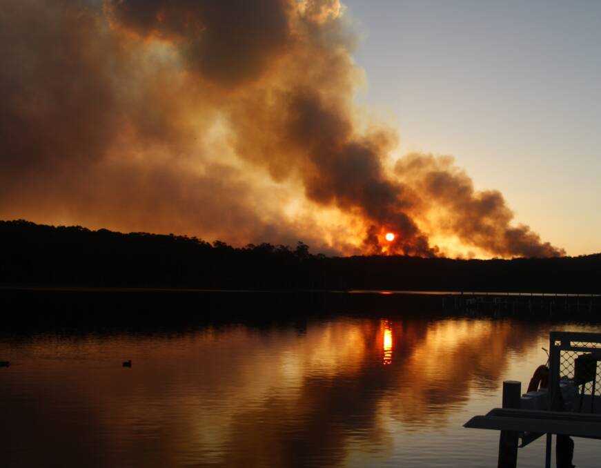 PIC OF THE WEEK: Christine Moss captured the smoke over Burrill Lake during the fire emergency. Send photos to editorial.mutimes@fairfaxmedia.com.au