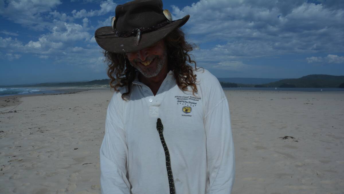 PIC OF THE WEEK: Shorebird volunteer Neal Cameron with diamond python by Colin Ashford. Send photos to editorial.mutimes@fairfaxmedia.com.au