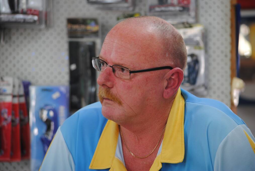 WAITING GAME: Rob McFadyen of Rob's Bait N Tackle in Burrill Lake says takings are down $50,000 because of the bushfire crisis. Photo: Sam Strong