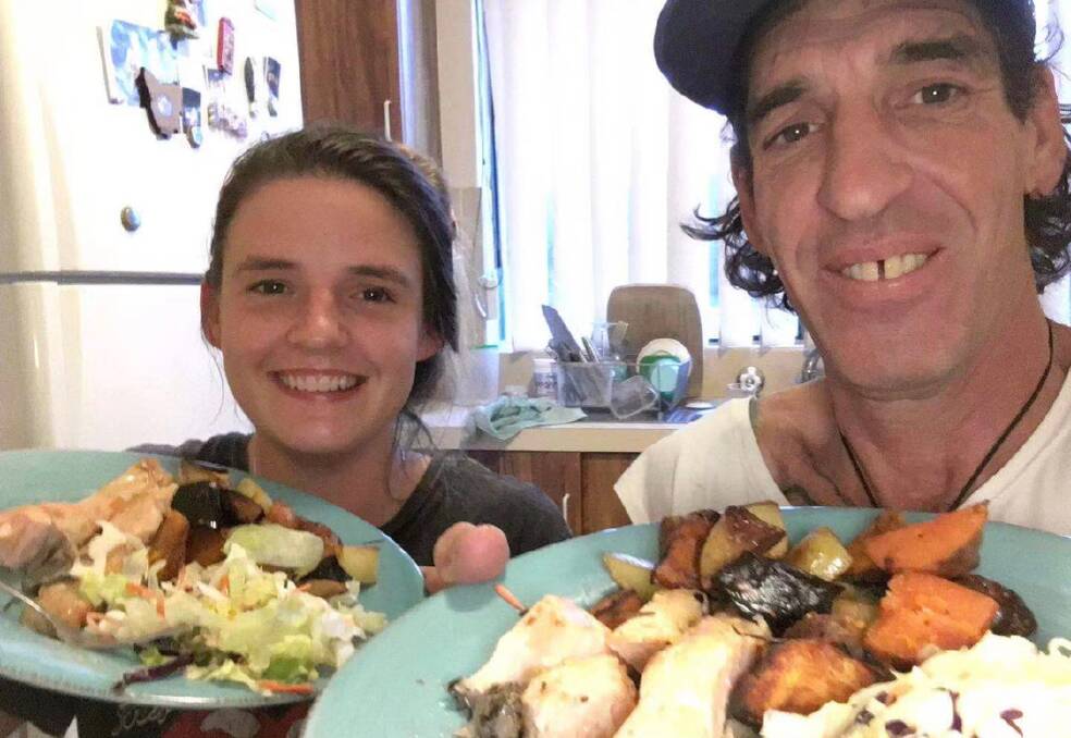TUCKER: Jess McLean and her father Tim enjoy a baked dinner in Ulladulla before he travelled to Wuhan.