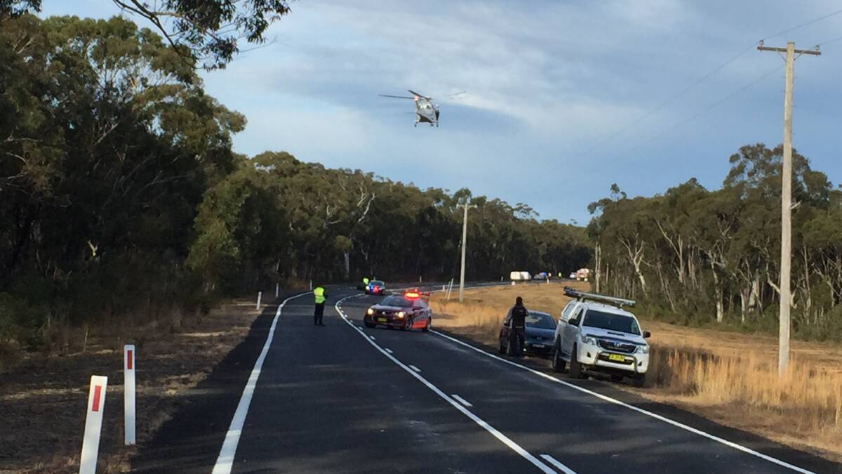 CRASH SITE: The Toll ambulance helicopter comes in to land on Braidwood Road.