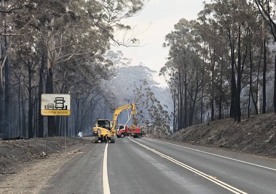 BLOCKED: Crews remove one of thousands of trees from the Princes Highway in December 2019. Photo: John Hanscombe