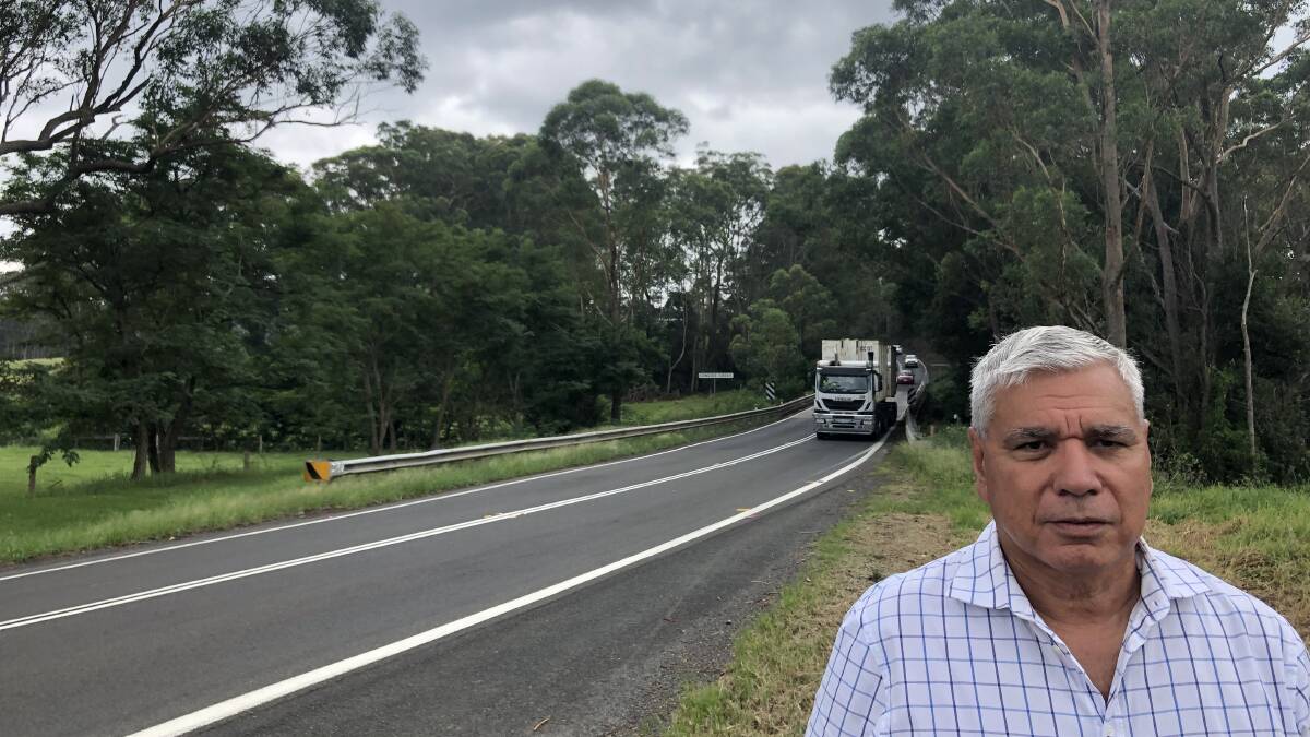 STAYING PUT: Unsuccessful Liberal candidate Warren Mundine inspects the Princes Highway in February.