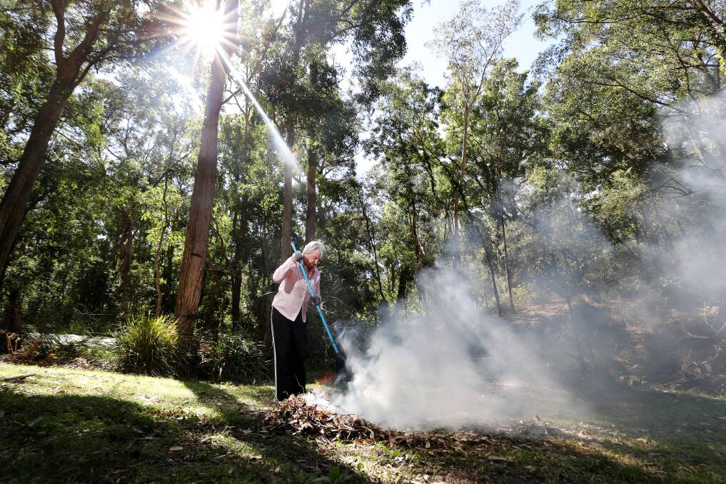 Kangaroo Valley resident Eileen Judge has been clearing her property of leaf debris. Picture: Robert Peet
