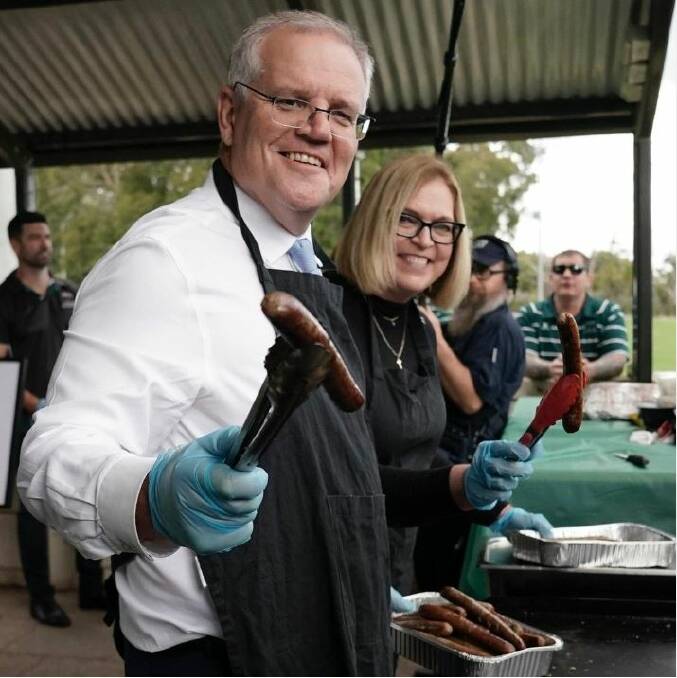 Scott Morrison cooks up a democracy sausage. Picture: Instagram