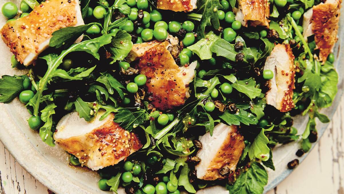Crispy-skinned chicken with peas and capers. Picture: Chris Middleton