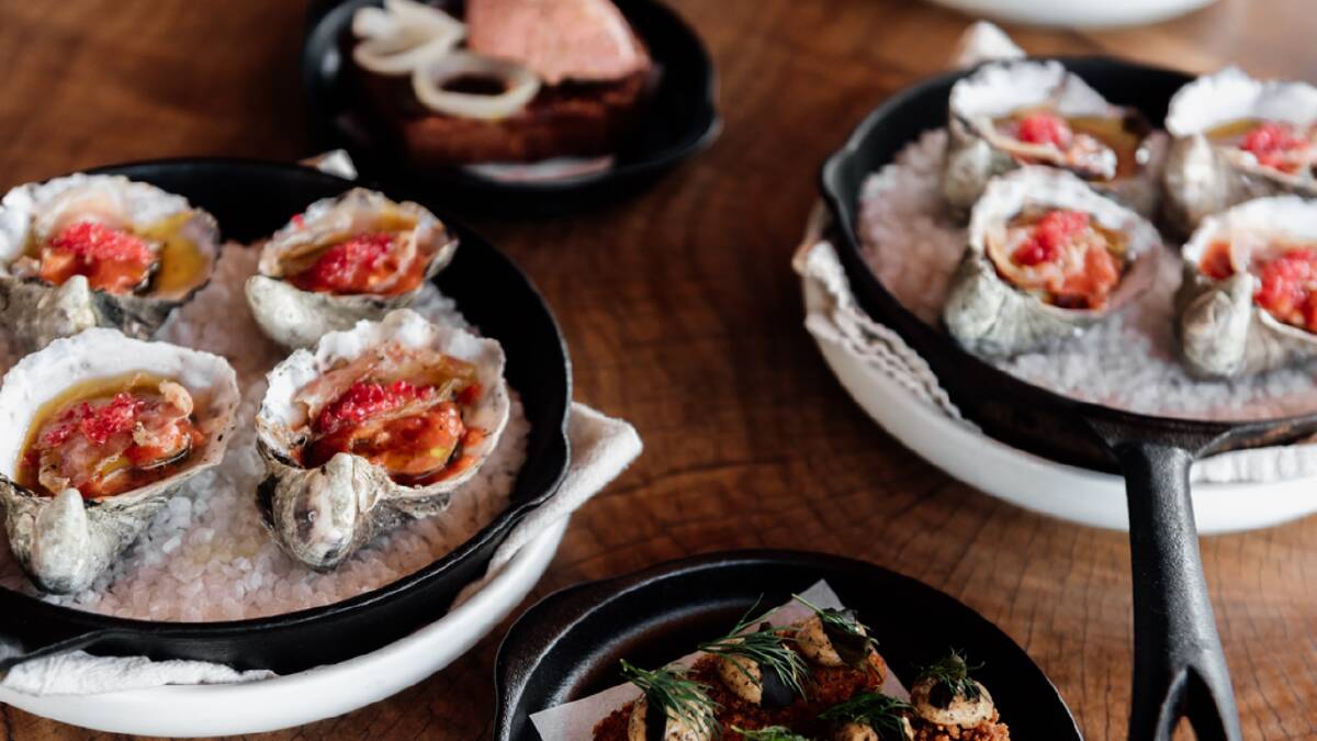 Fire roasted oysters with fermented tomato and pork jowl. Picture by River & Her Photography 