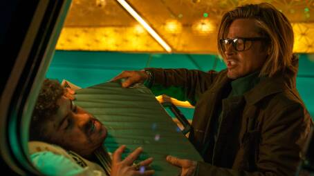 Benito Antonio Martnez Ocasio encounters Brad Pitt in Bullet Train. Picture: Scott Garfield
