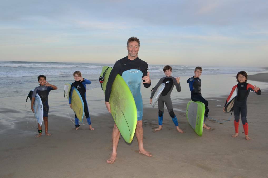  Rusty Moran with surf students at Seven Mile Beach.