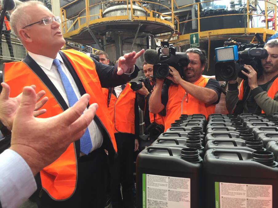 Prime Minister Scott Morrison tours the factory with dozens of journalists in tow on Monday. Picture: Rebecca Fist
