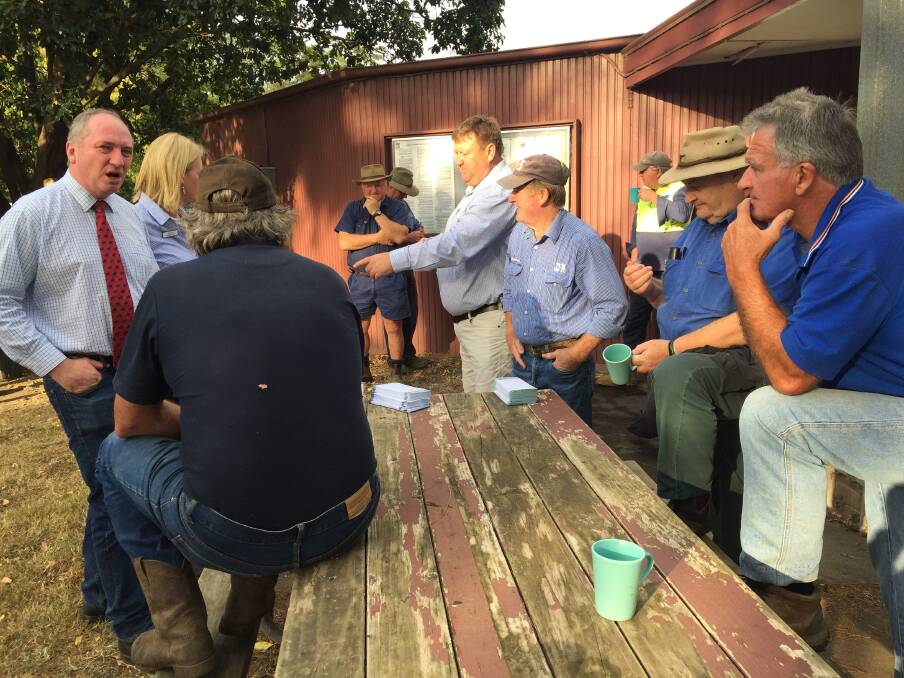 OPEN CONVERSATION: Barnaby Joyce, Katrina Hodgkinson and regulars at the Nowra Saleyards on Thursday morning. Picture: Rebecca Fist