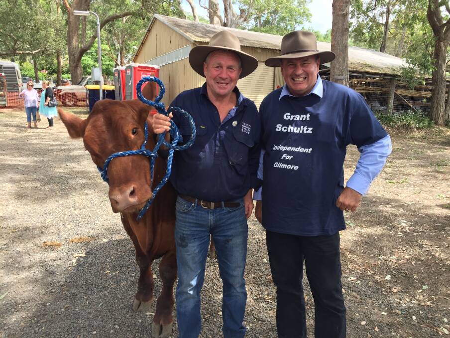 BRANCHING OUT: Independent Gilmore Candidate Grant Schultz with Dave Kent, who was raising funds for flood-affected Queenslanders at the Kangaroo Valley Show on Saturday. Picture: Rebecca Fist.