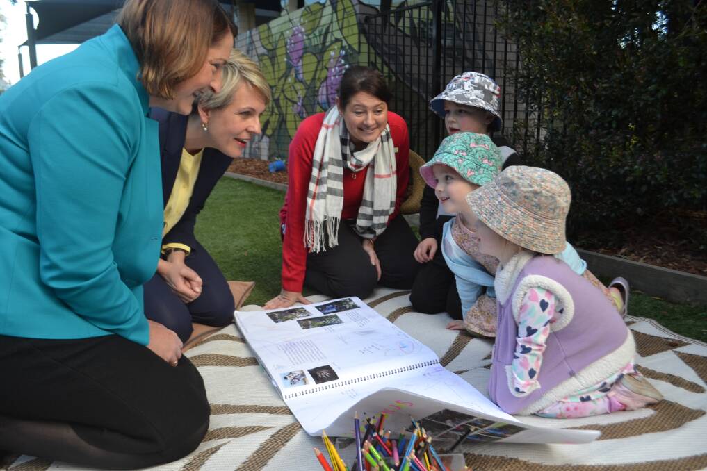 Fiona Phillips and Tanya Plibersek with Noah, Madelyne and Chelsea at Jerry Bailey Children’s Centre in Shoalhaven Heads on Thursday. Picture: Rebecca Fist