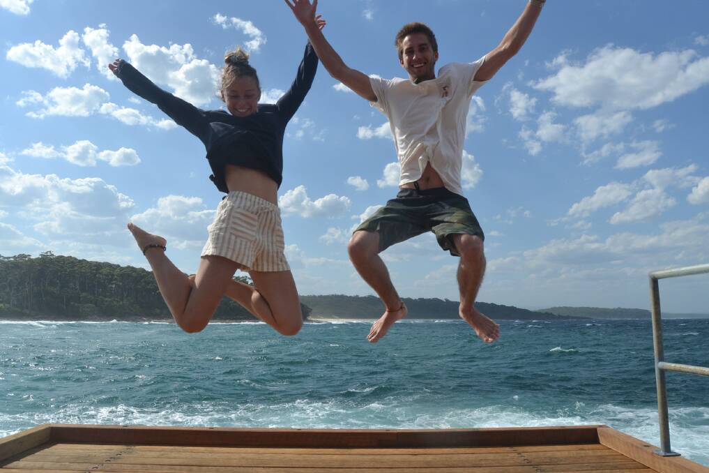 Bawley Point's Nina Mocke and Rory Betts-McCrae jumping for joy at the return of the historic Bawley Point Gantry.