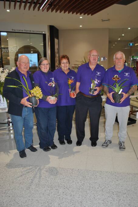 SPRING ORCHIDS: Milton Ulladulla Orchid Society committee members Bob Harper, Marilyn Higgins, Michelle and Bruce McIntosh and Wayne Hamilton.