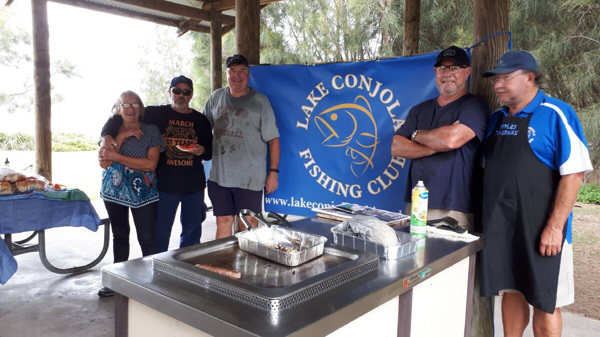 Volunteers enjoy a barbecue after the clean up at Lake Conjola. Photo: Supplied. 