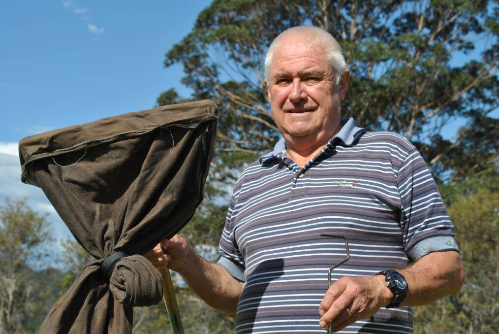 SNAKE CATCHER: Ian Ross has been relocating snaked from Shoalhaven homes and yards for five years. 