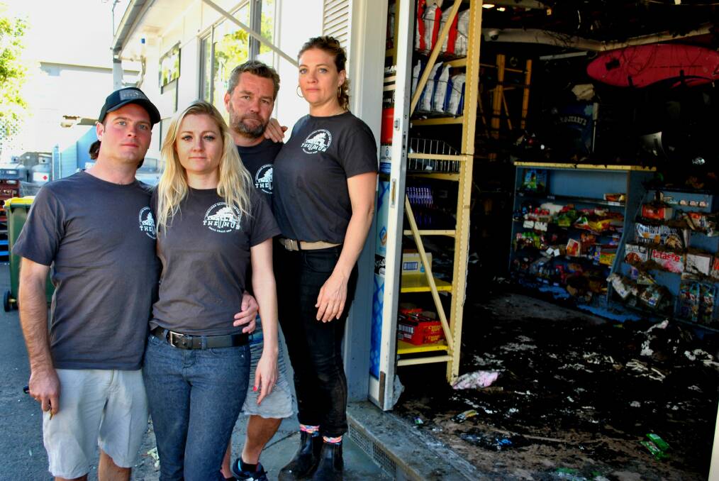 FIRE: Bendalong General Store and Cafe owners Kevin and Jessica Kensley and Matt and Kristy McBride assess the damage after a fire started in the store's roof last week.