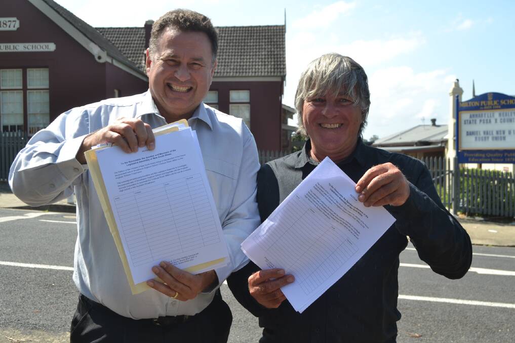 SIGNED: Grant Schultz and Darryl Snow want the community to get behind a petition calling on the NSW Government to purchase land for a second high school. 