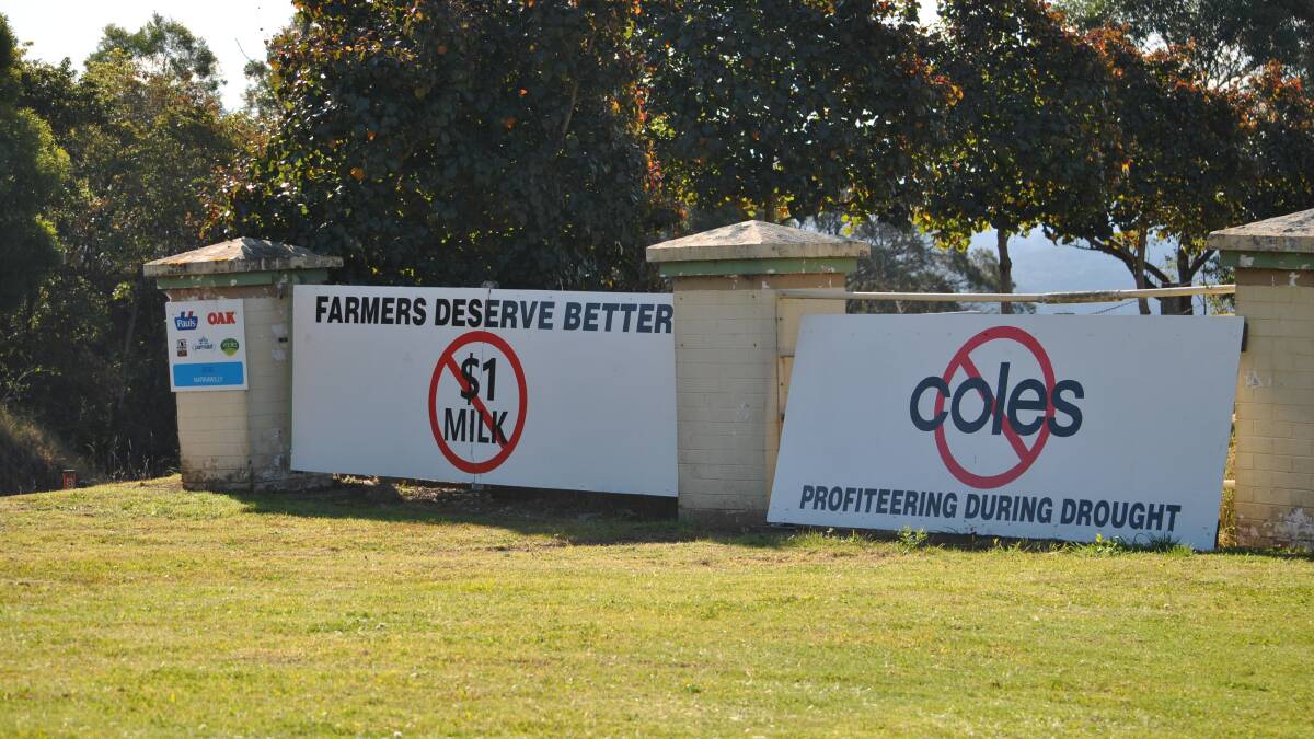 The signs erected on the Princes Highway at Miltn show a message from dairy farmers desperate for a price rise to stay in business during the drought. 
