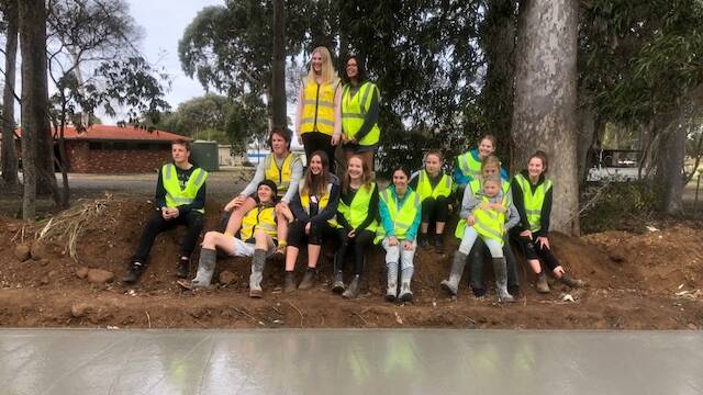 TOP JOB: The youth of Bawley Point and Kioloa admire their work after completing a section of the Community Connect concrete pathway. Photo: Supplied. 