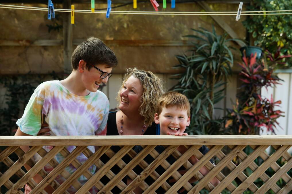 GRATEFUL: Danielle O'Brien with sons Kai and Reece in their backyard at Anna Bay on Friday. Picture: Jonathan Carroll 