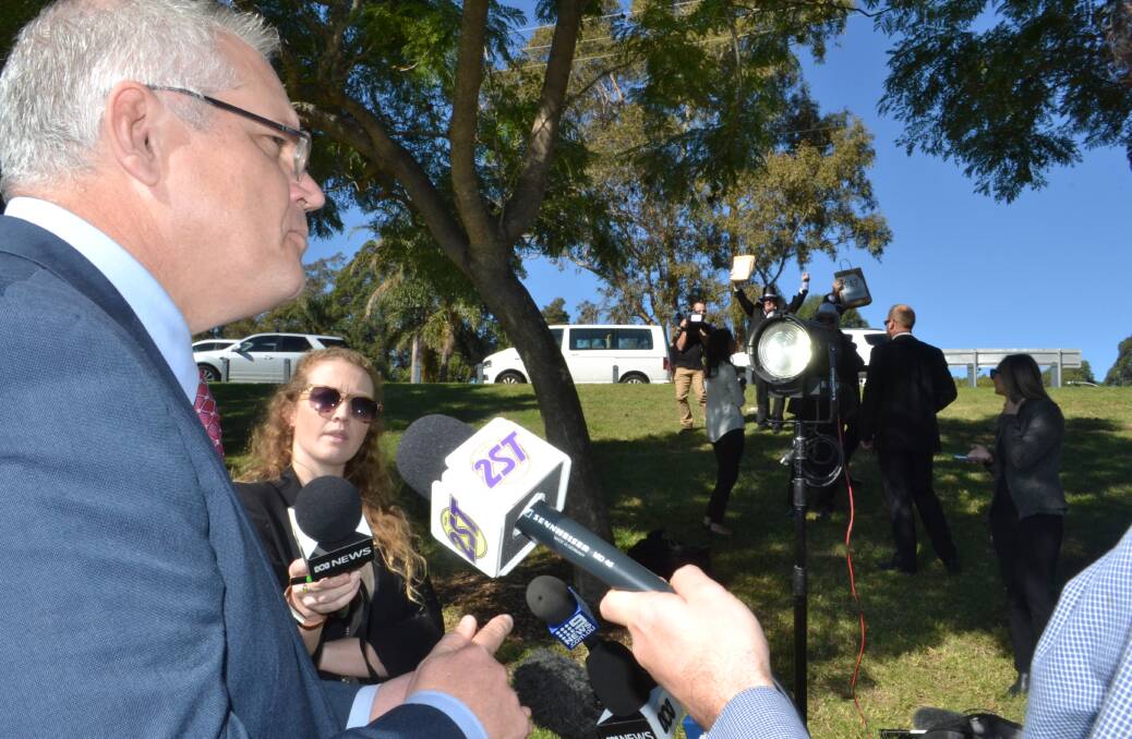 Federal Treasurer Scott Morrison talks over protesters to this year's budget during his visit to Nowra on Thursday. Photo: Rebecca Fist