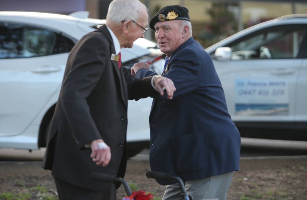 MATES: President of the Berry RSL Ray Strong greets National Serviceman Jim Reid prior to Tuesday's service.