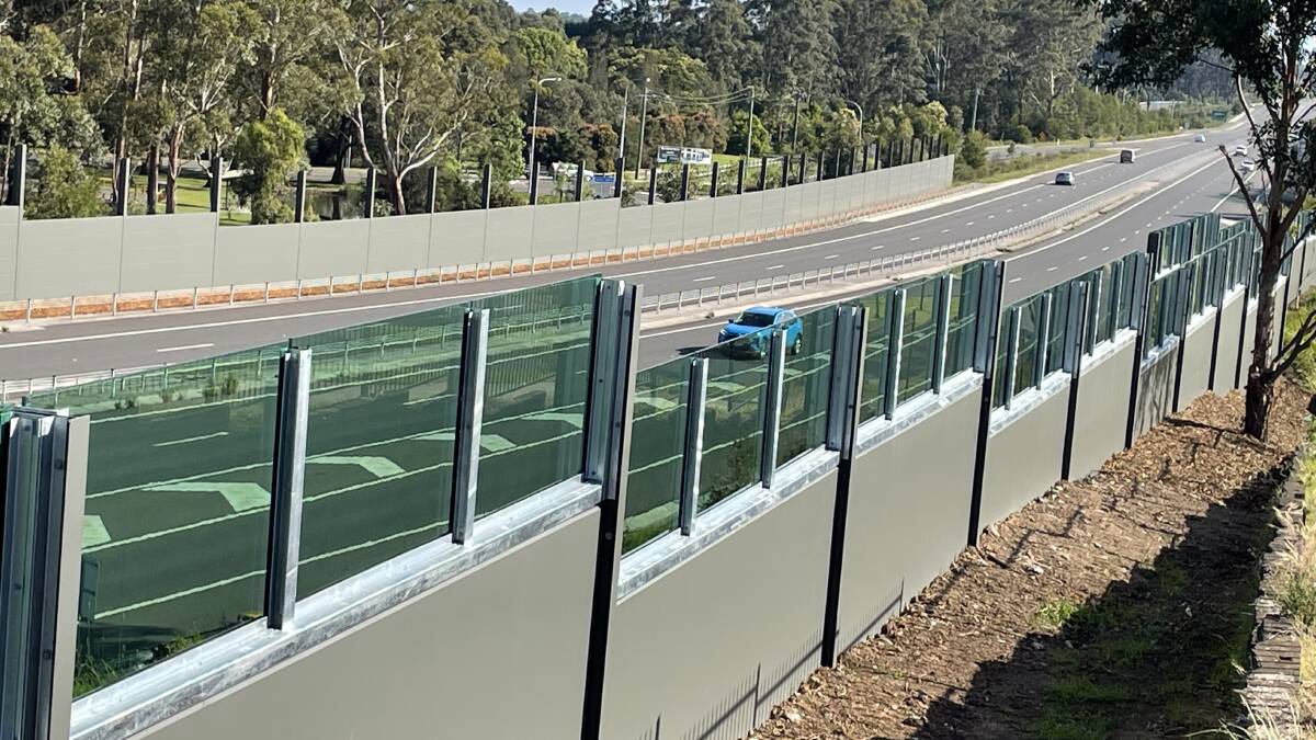 ALMOST COMPLETE: The noise walls run for around 300 metres on both sides of the Princes Highway, south of the Kangaroo Valley Road overpass, near Windsor Drive and Huntingdale Park Road.