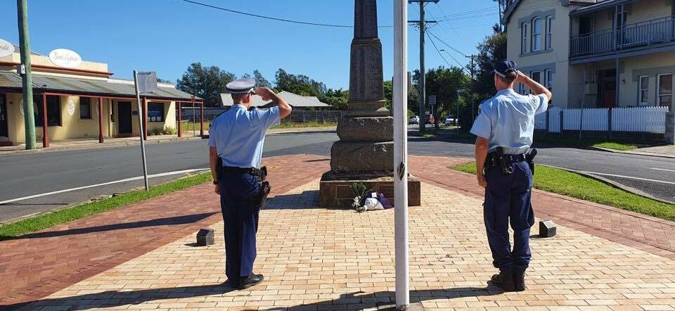 South Coast Police officers show their respect at Milton.
