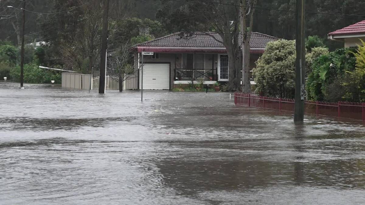 Homes being inundated in The Park Drive, Sanctuary Point. Photo: Dave Cunningham TVN