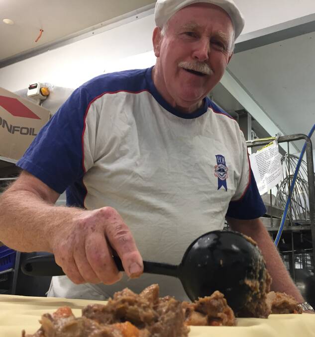 HARD AT IT: John Reminis Snr creating another batch of Australia's best venison pies. 