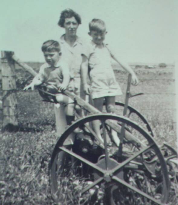 HAY TIME: Merv with his mother Ivy and brother Terry on an early hay rake.