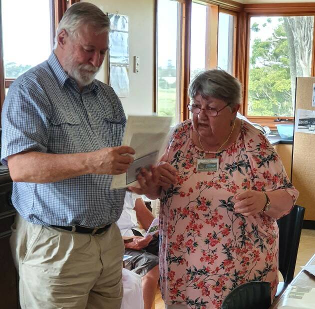 HAND OVER: Life member John Graham presents the precious letter to Gerringong and District Historical Society president Helen McDermott 