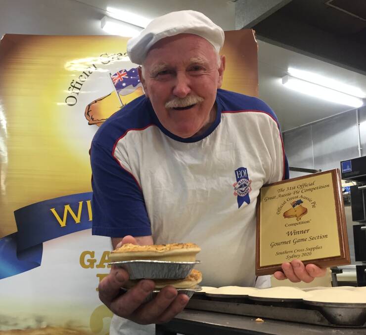YOU BEAUTY: John Reminis Snr proudly shows off the Champion Game Pie award from the Great Aussie Pie Competition.