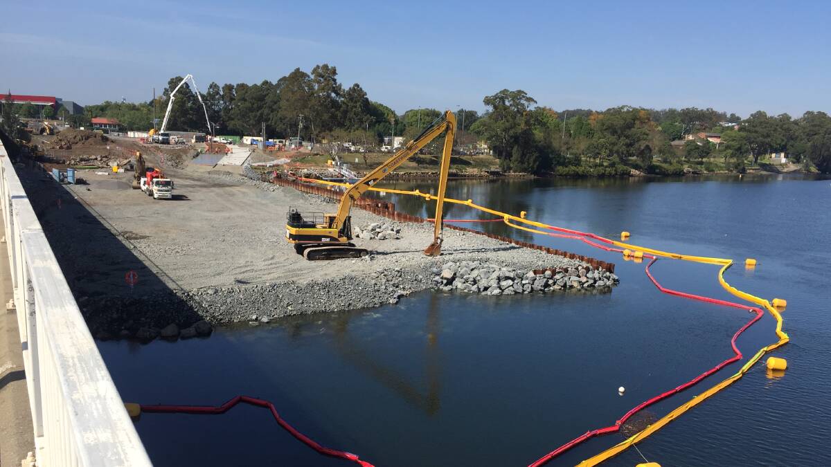 MASSIVE WORK: The temporary rock platform into the Shoalhaven River includes around 22,000 tonnes of material and is approximately 130m long and around 45m wide.