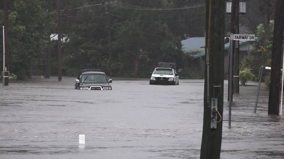 Cars stuck in floodwaters at The Park Drive, Sanctuary Point. Sanctuary Point flooding. Photos: Dave Cunningham TVN