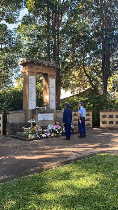 Commander of South Coast Police District Superintendent Greg Moore and local Berry officer Senior Constable Kyle Lavender lay a wreath at Berry.