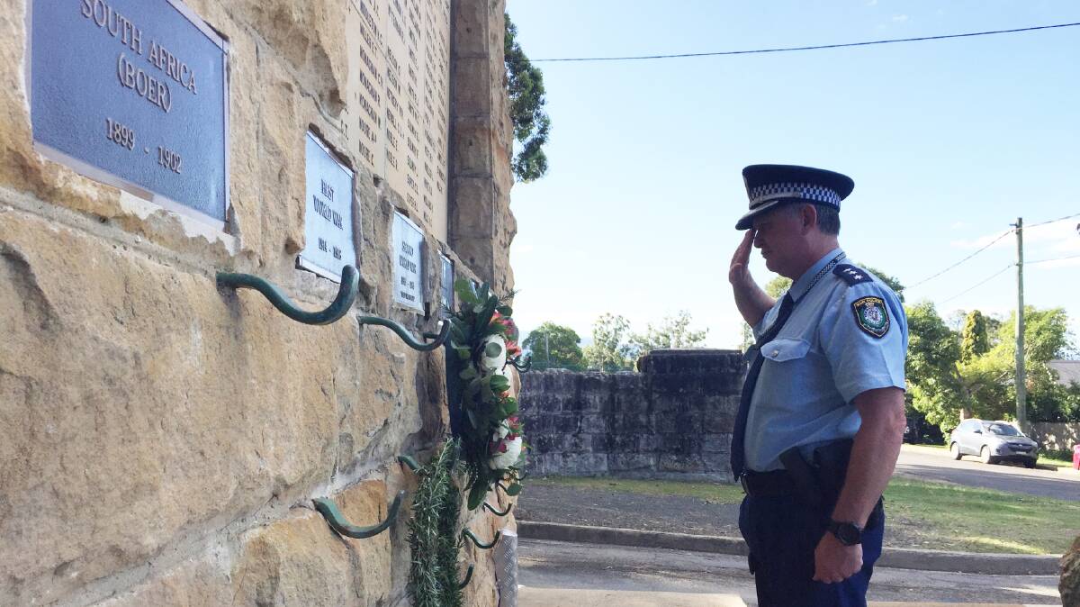 Officer in Charge of the Nowra Police Station, Inspector Ray Stynes lays a wreath to mark Anzac Day at the Nowra memorial. 