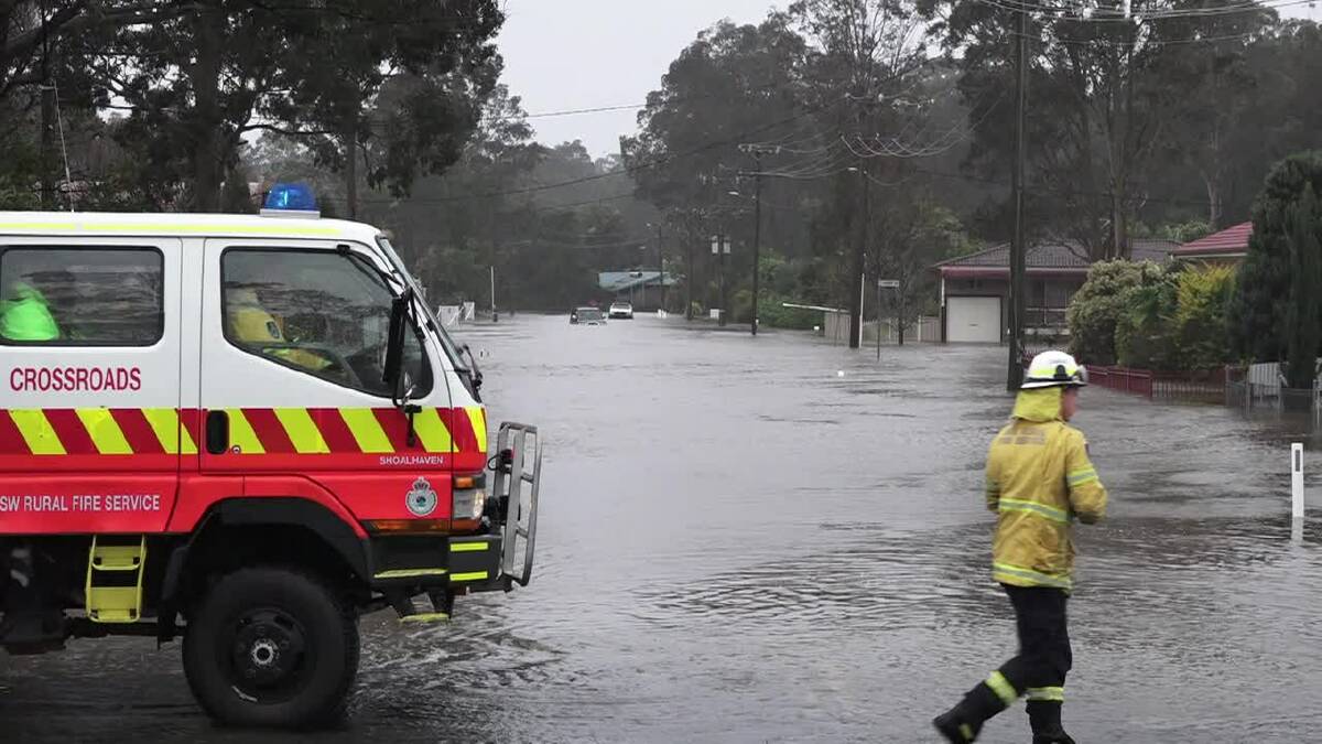 Emergencey services working in the floods at The Park Drive, Sanctuary Point. Photo: Dave Cunningham TVN