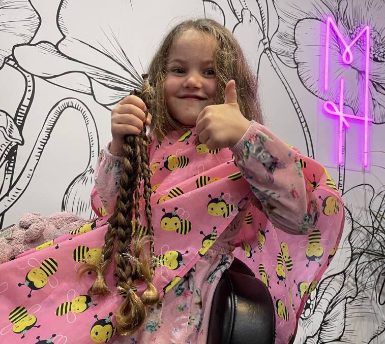 GONE: Six-year-old Pippa Southam proudly shows off her long hair which she cut for Variety, The Childrens Charity Hair With Heart campaign, which also raised $4370.