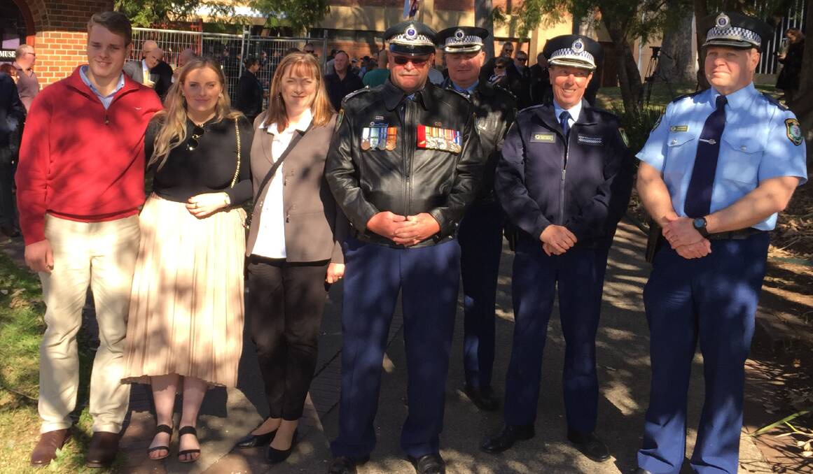 FOND FAREWELL: Sergeant Sean Phillips with his wife Julia and children Jackson and Jamison with Officer in charge of Nowra Police Station, Inspector Ray Stynes, South Coast Police District Commander, Superintendent Greg Moore and Acting Southern Region Commader, Acting Assistant Commissioner Bob Noble.

