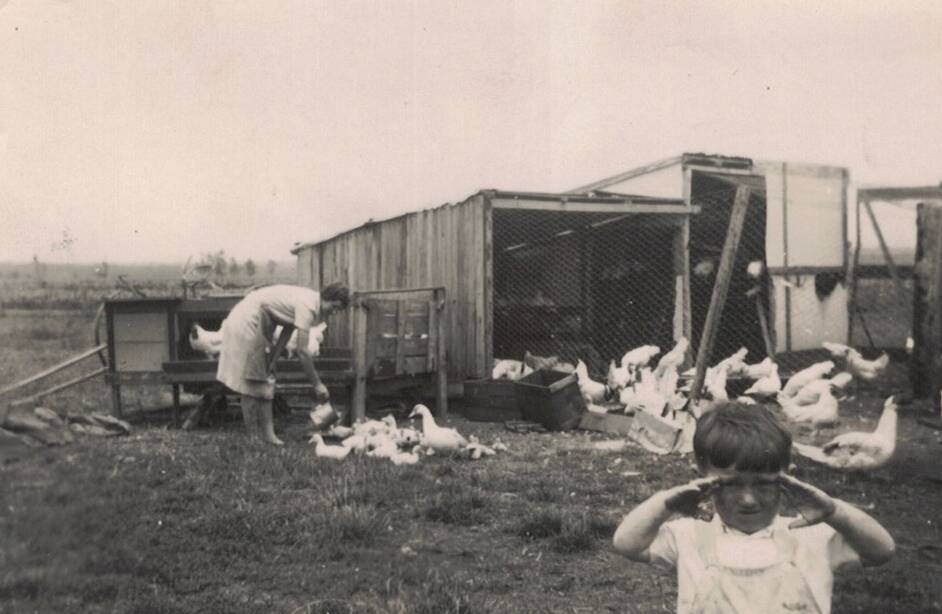SUPPLEMENT: Mervyn with his mother Ivy and the family's chooks.
