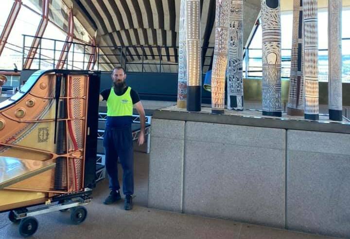 Specialised removalist Trevor Vines has touched pianos in some of the most amazing venues from the Sydney Opera House to the lounge-room of Russell Crowe. But he can only play one song, 'Lean On Me'. Picture supplied.